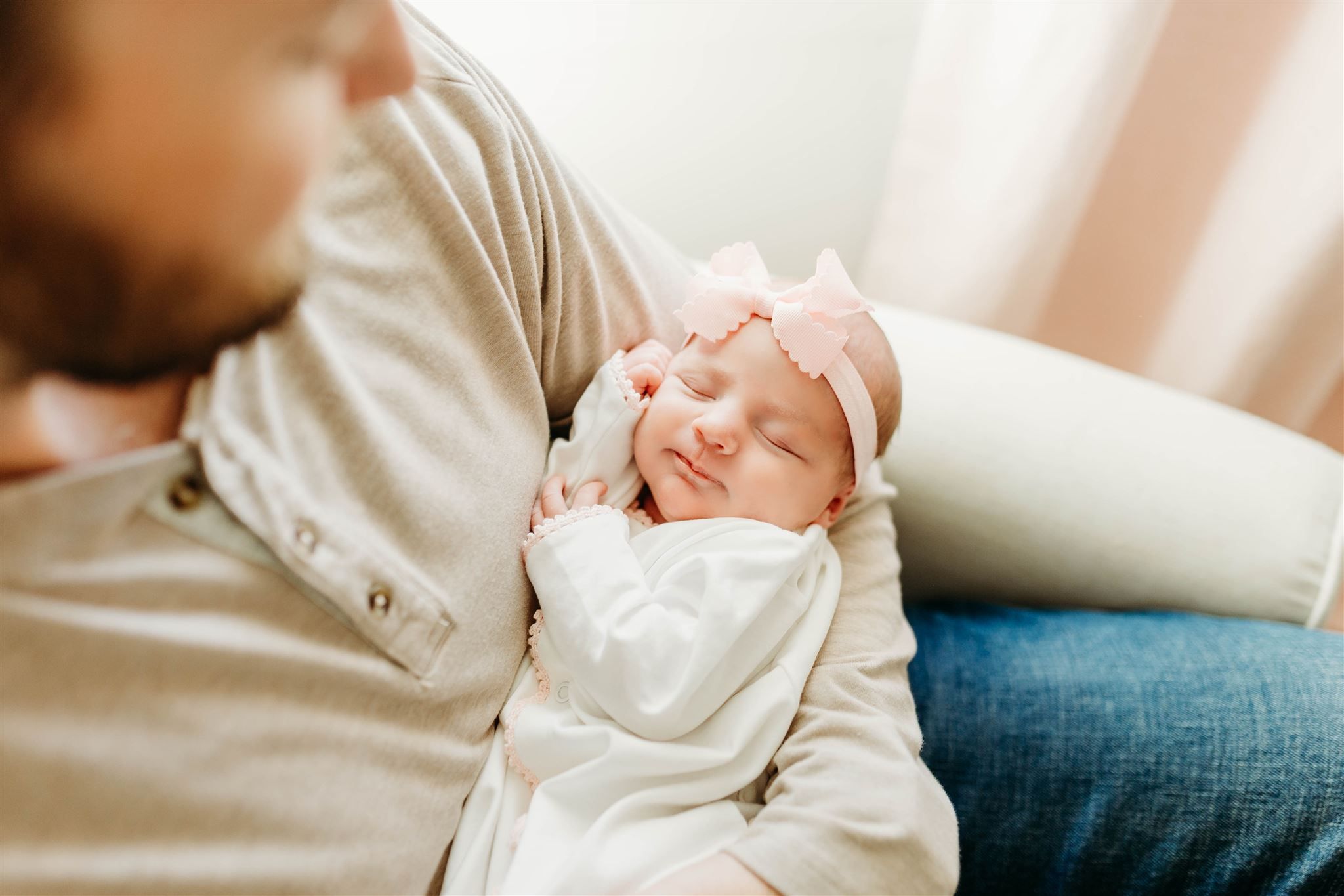 baby in dad's arms