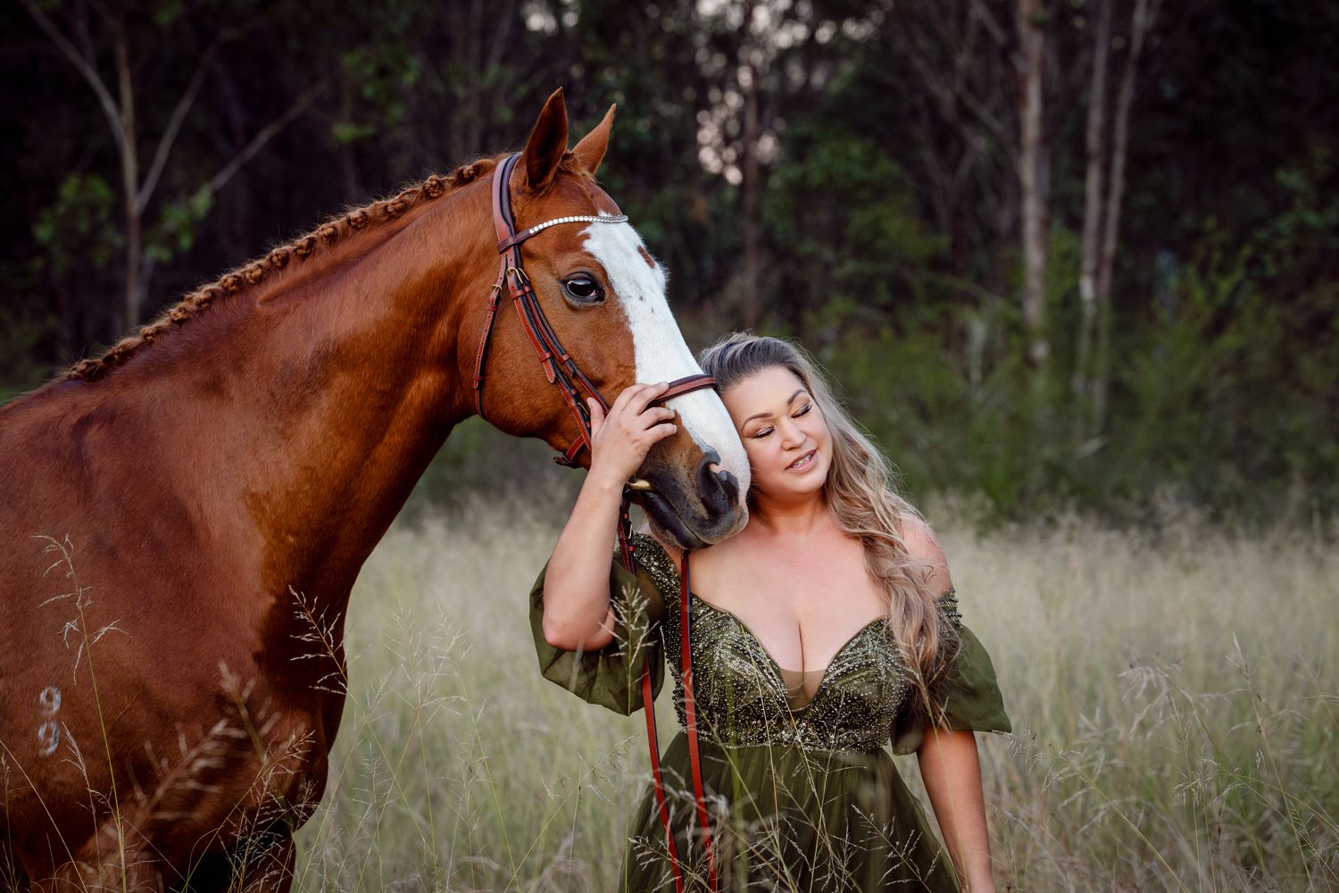 A chestnut horse and person share tender moments in a grassy field during a golden hour photoshoot with a horse in Sydney