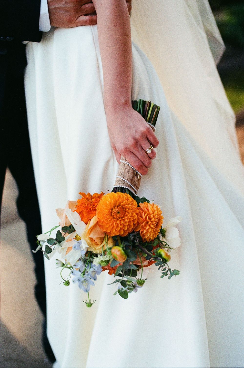 A film photograph of a bride holding a marigold bouquet taken by a Santa Barbara wedding photographer.