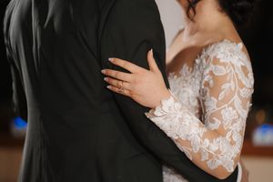A romantic first dance moment between newlyweds at their wedding reception.