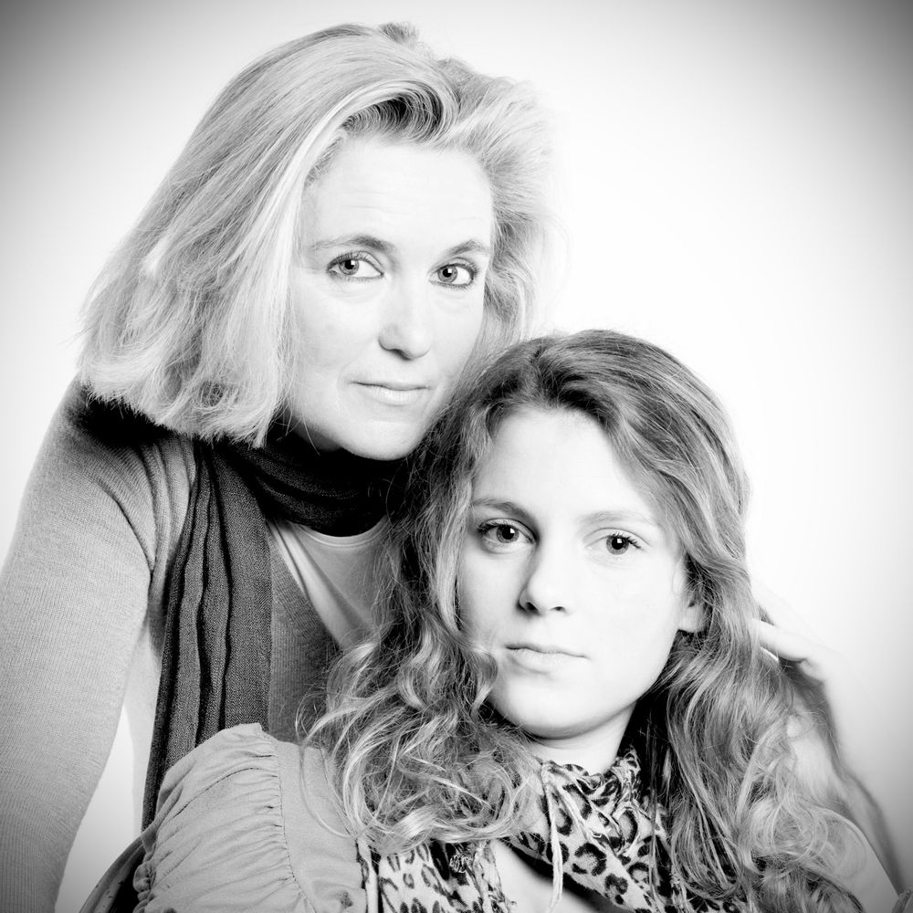 Black and white portrait series showing artistic close-up shots with dramatic lighting.