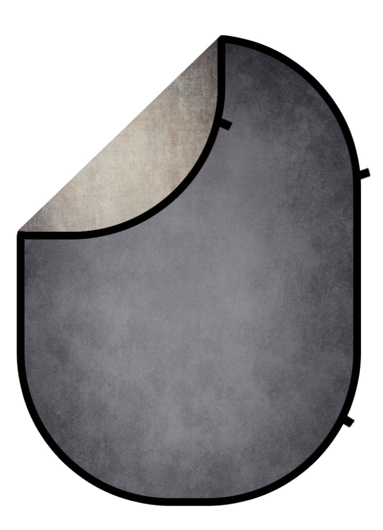 Reversible collapsible photography backdrop with gray textured front and beige mottled reverse side, oval shape with black trim.