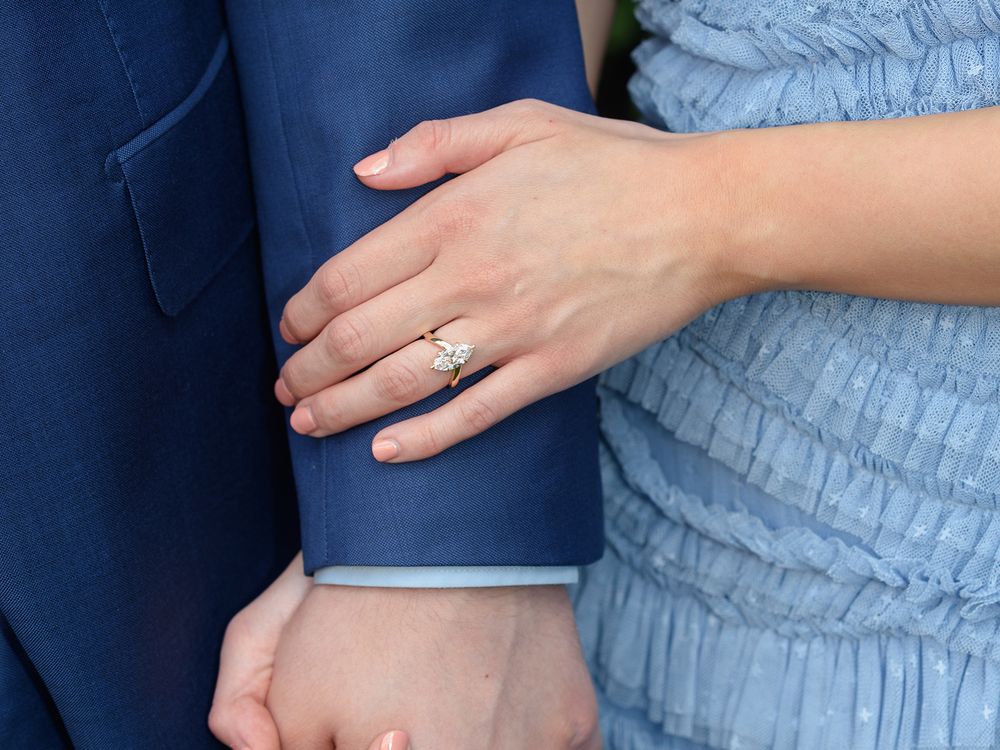 A man and woman holding hands, captured in engagement photography by Abigail's studio in High Wycombe.