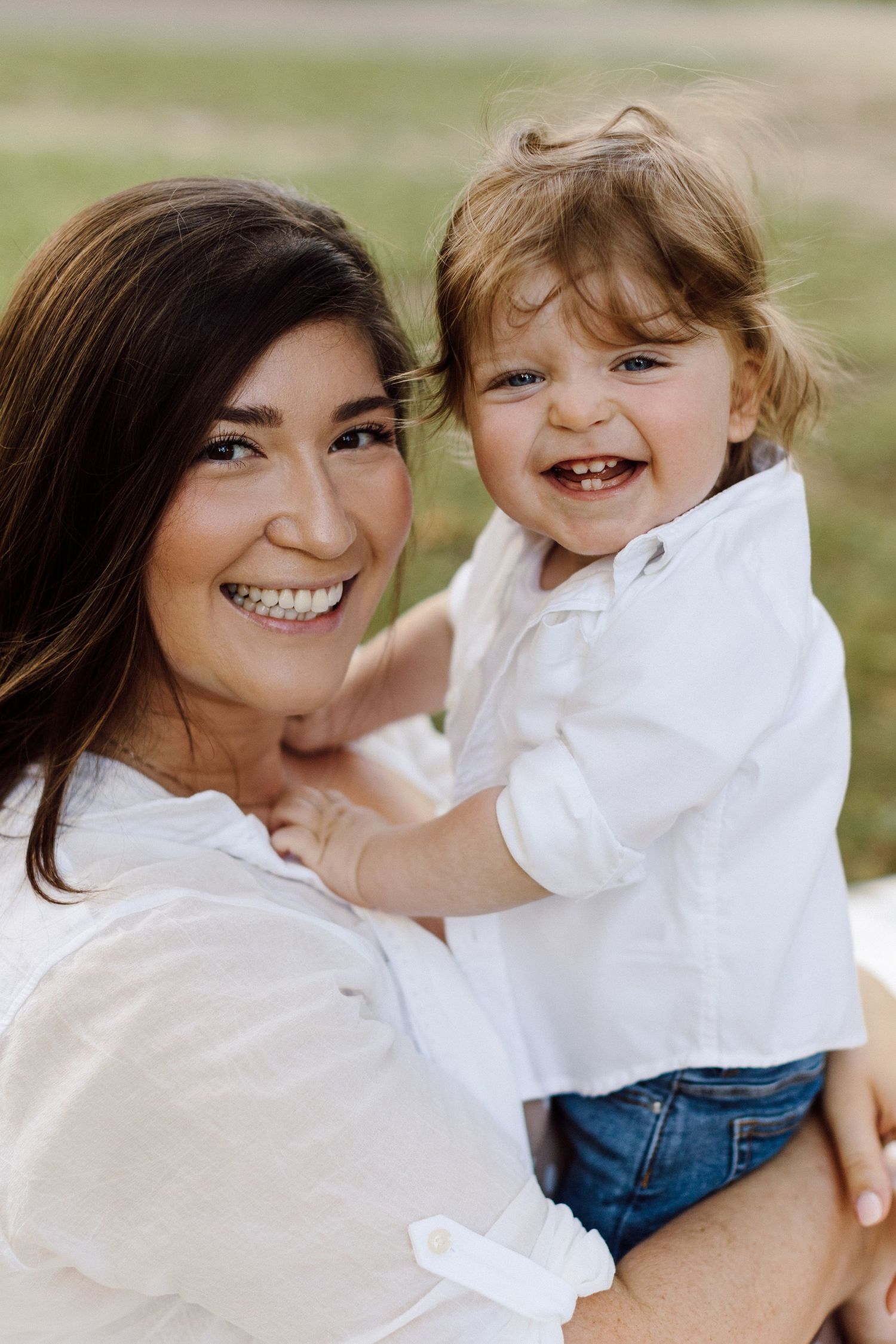 Candid family portraits capturing genuine smiles and happiness outdoors.