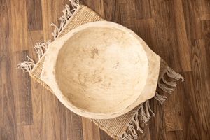 White distressed round wooden bowl with flat small handles