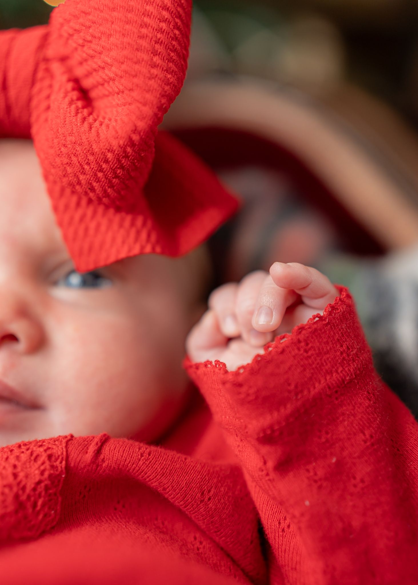 Close-up detail of red holiday clothing and white knit texture.