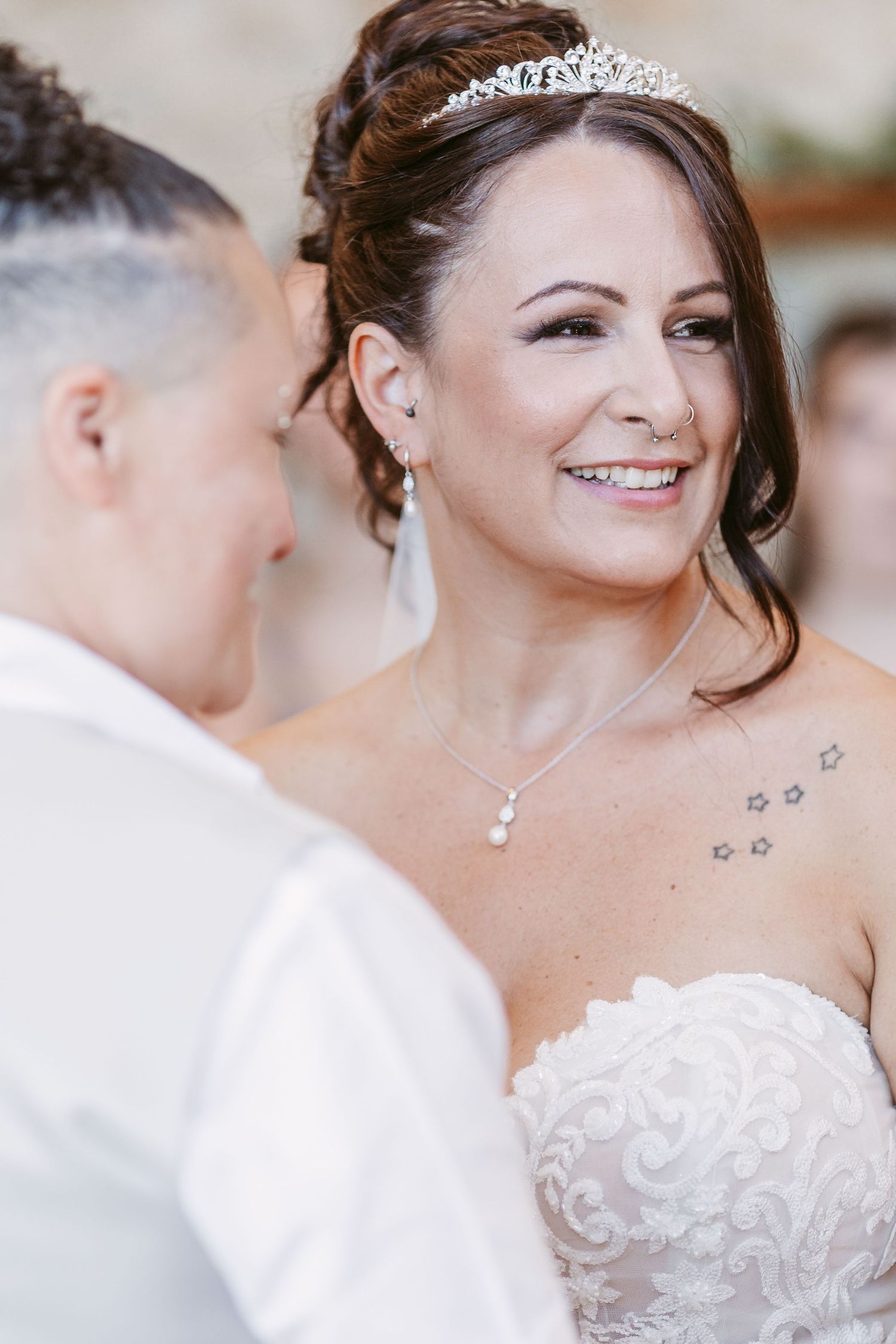 Close-up details of bridal jewelry and accessories including a sparkling tiara and necklace.