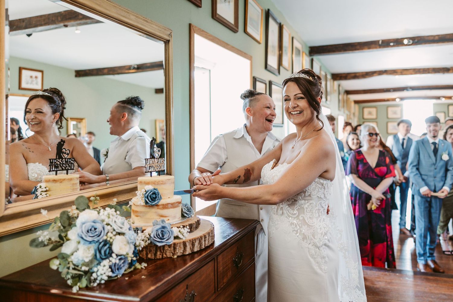 Wedding couple sharing intimate moments in a rustic indoor venue.
