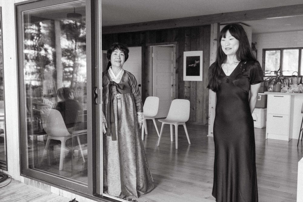 Black and white photos of guests in formal attire at an indoor venue.