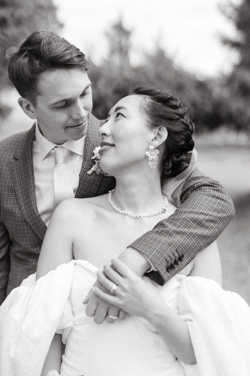 Black and white wedding portraits showing intimate moments between newlyweds.
