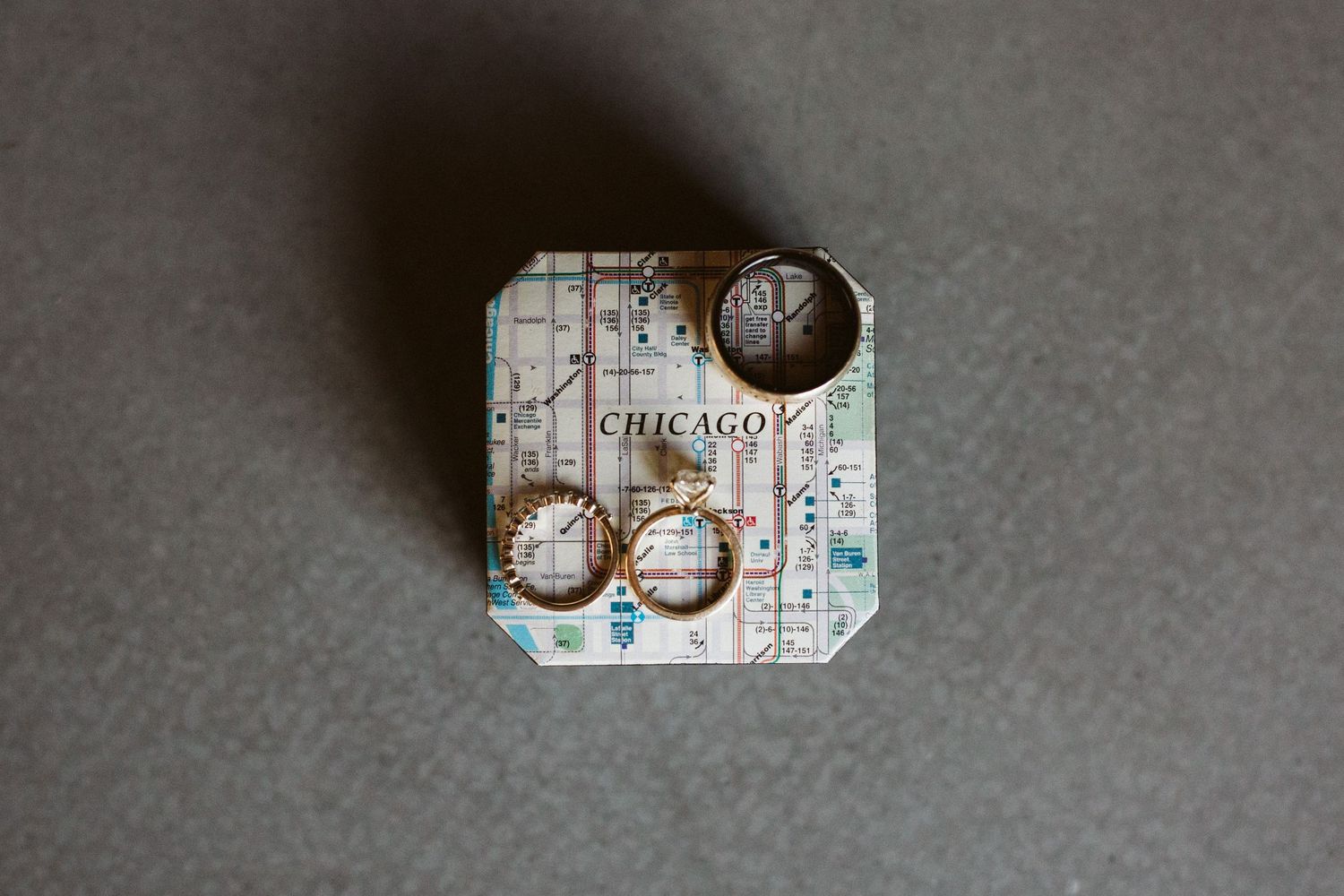 Chicago transit map with vintage coins displayed on a gray background.