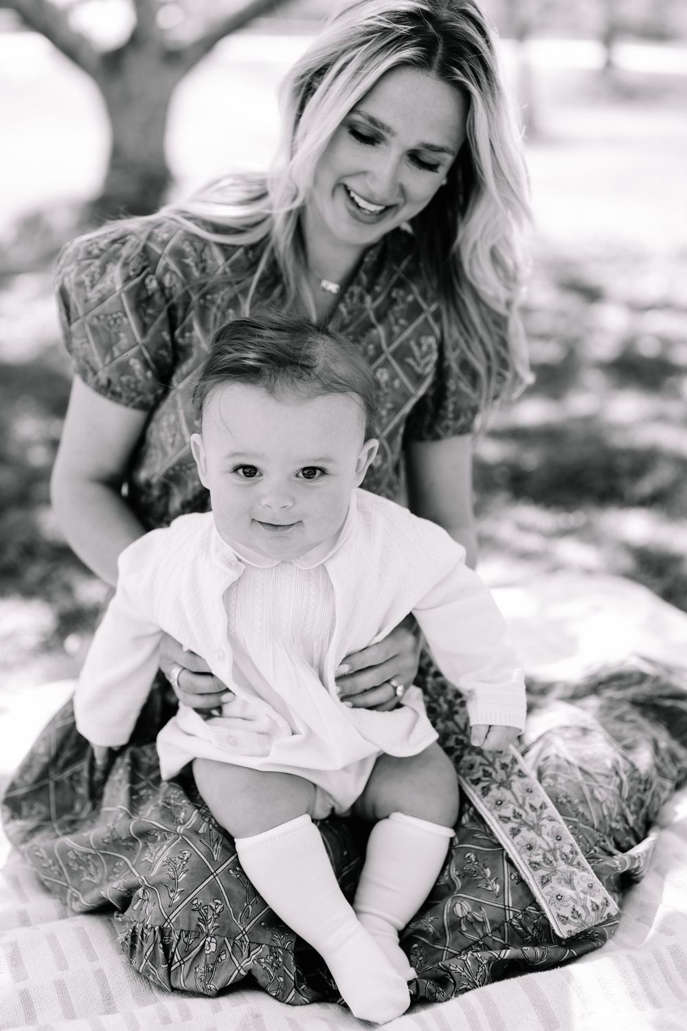 Baby boy during a flowering mini session in Marietta GA  with his mom