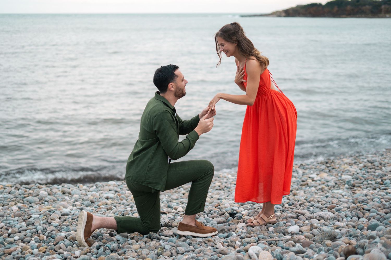 Joyful beach celebration with champagne pop at sunset.