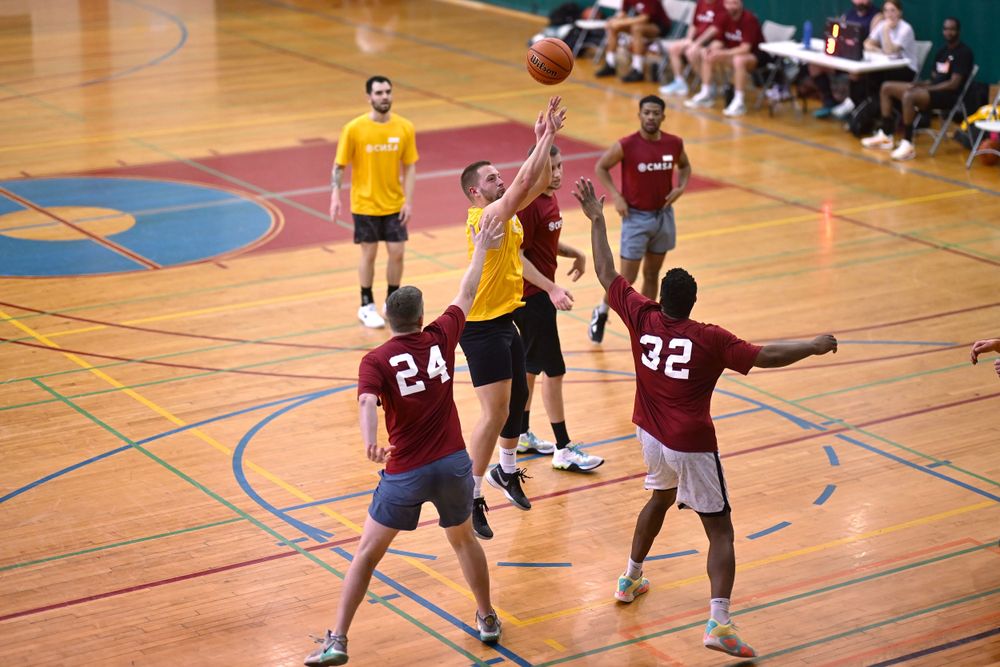 A CMSA basketball athlete attempts a jumpshot near the free throw line in a game of basketball at the Broadway Armory in Chicago