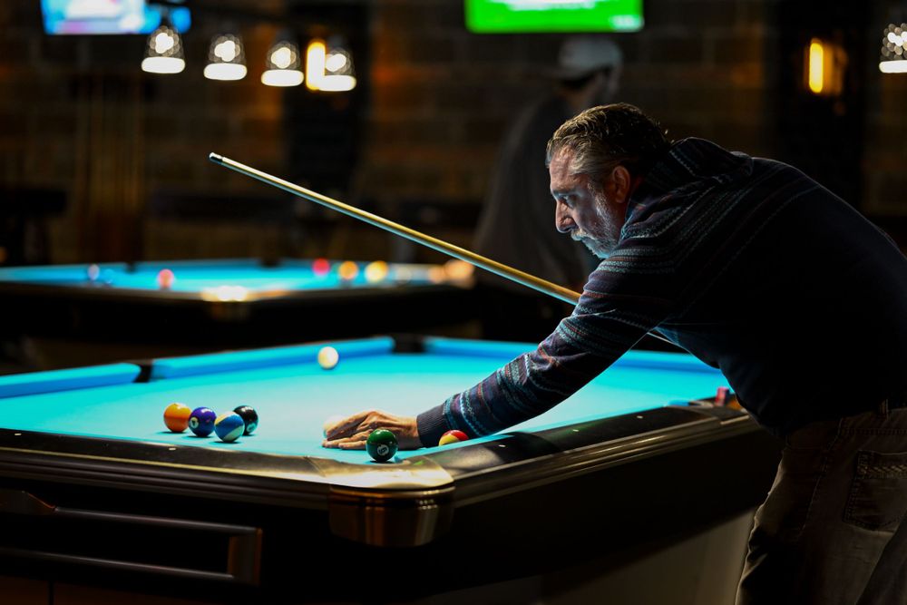 A CMSA player lines up his shot in a game of pool at Surge Billiards in Chicago