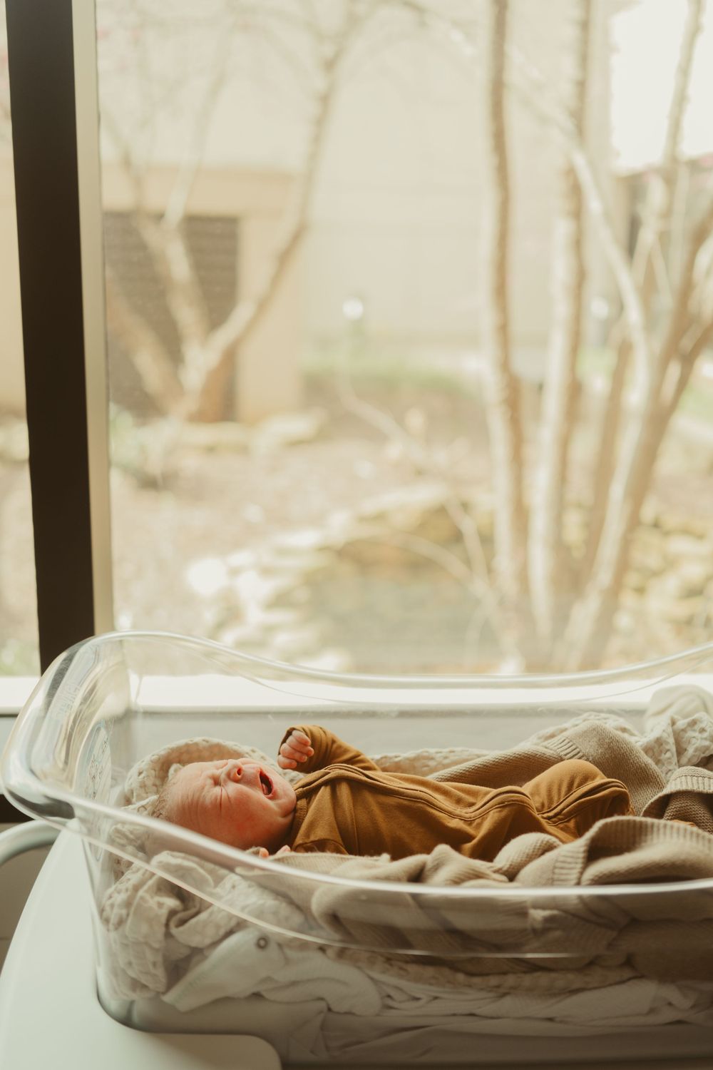 Newborn baby boy in bassinet born at Blanchfield Army Community Hospital in Fort Campbell, Kentucky documented by Disney Magic Photography.