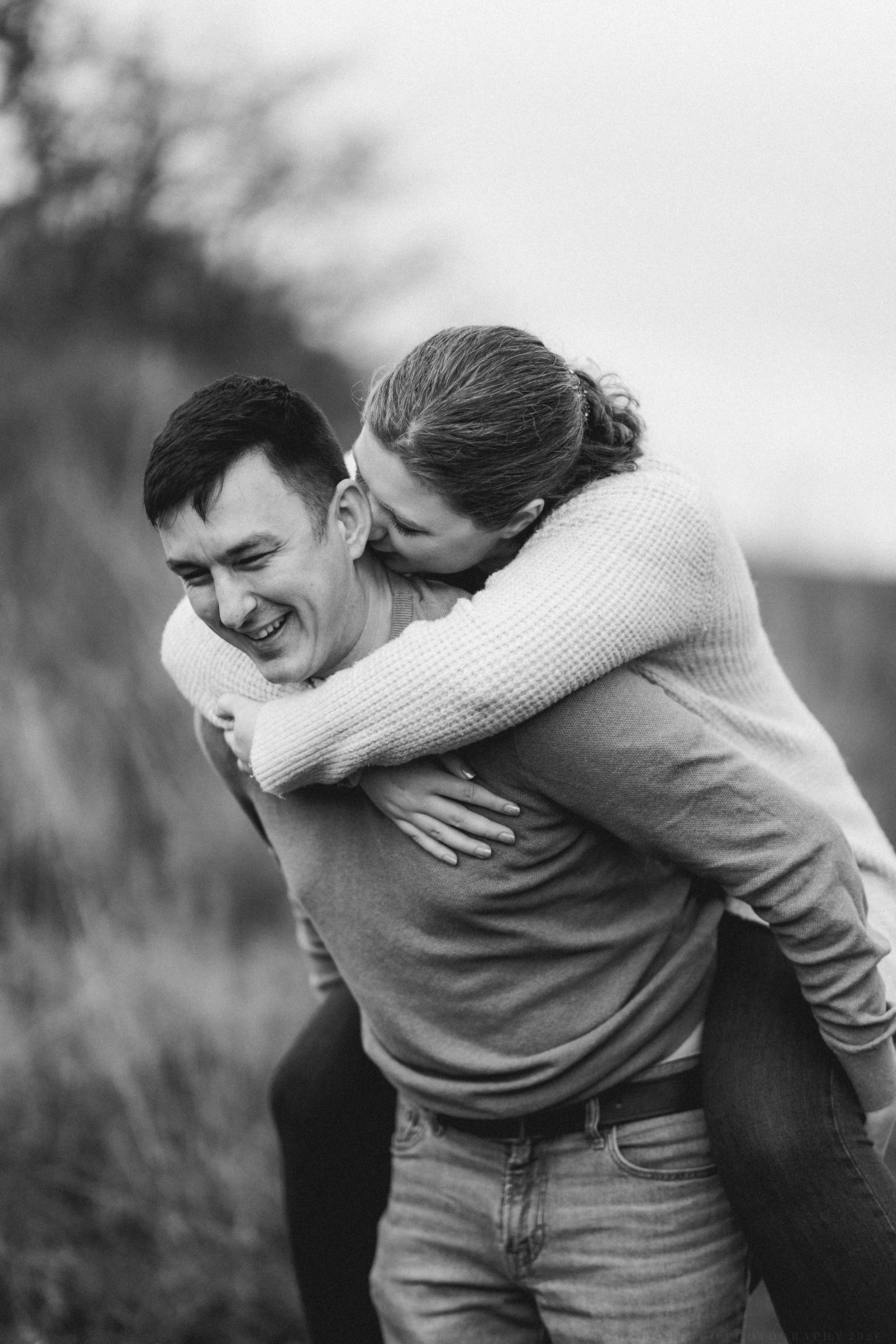 Series of candid black and white photos capturing playful piggyback ride moments outdoors.