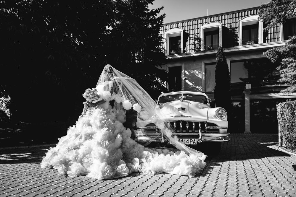 A collection of black and white wedding photographs arranged in a panoramic strip showing venue exteriors and decor details.