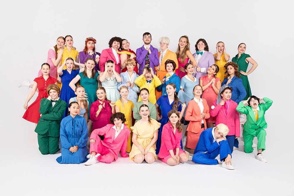 Group portrait of Capella Dance Academy youth dancers, white backdrop studio lighting