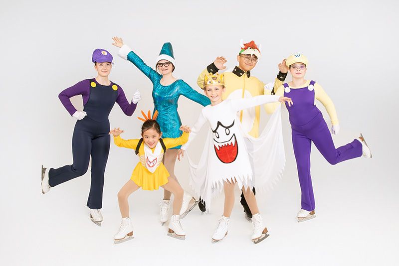 Youth skating group from Cheam Skating Club, posed group portrait on white backdrop