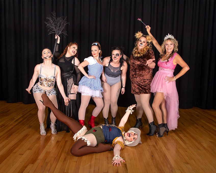 Adult dance class group posed on stage before show at Spencer Studios in Chilliwack