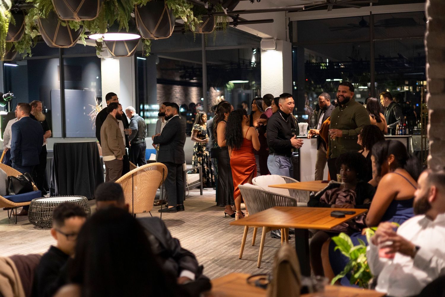 Wedding guests gathered in the rooftop space at the Revere Hotel in Boston for a wedding after-party.