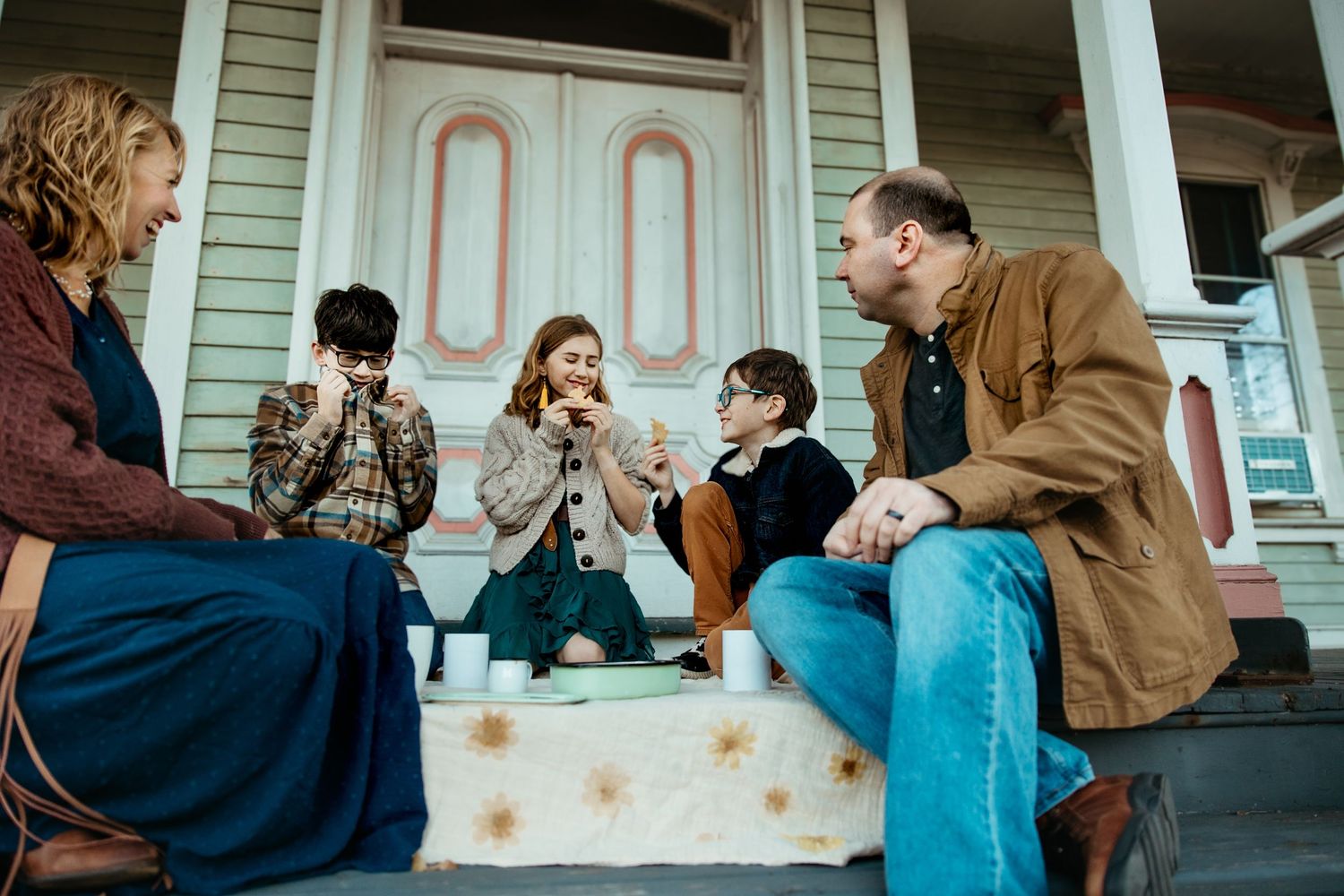 A series of candid moments captured on a porch showing people interacting and sitting together on a sunny day.