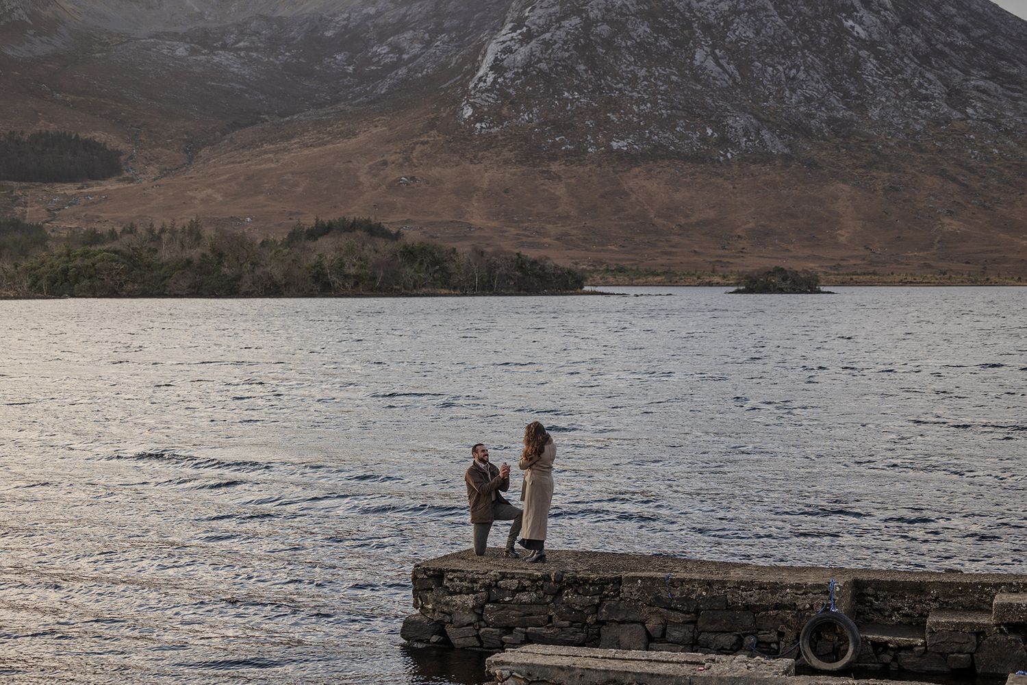 Couple embracing at Lough Inagh Valley during intimate sunset proposal