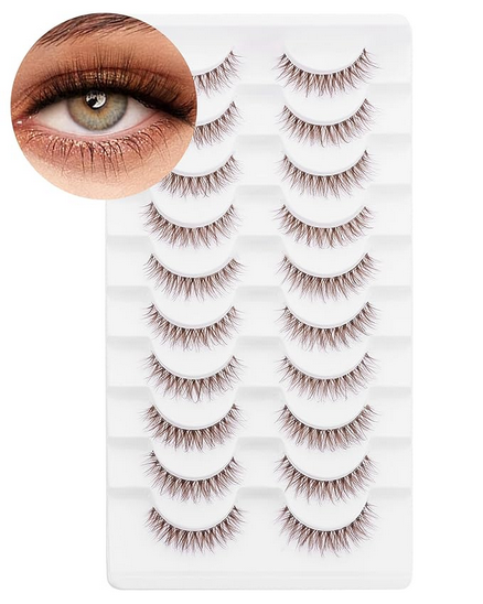 Display of natural-looking false eyelashes arranged in neat rows on white background.