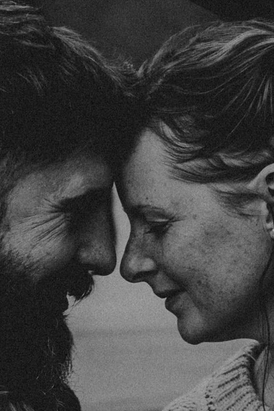 A black and white photo series showing two people in an intimate close-up moment together.