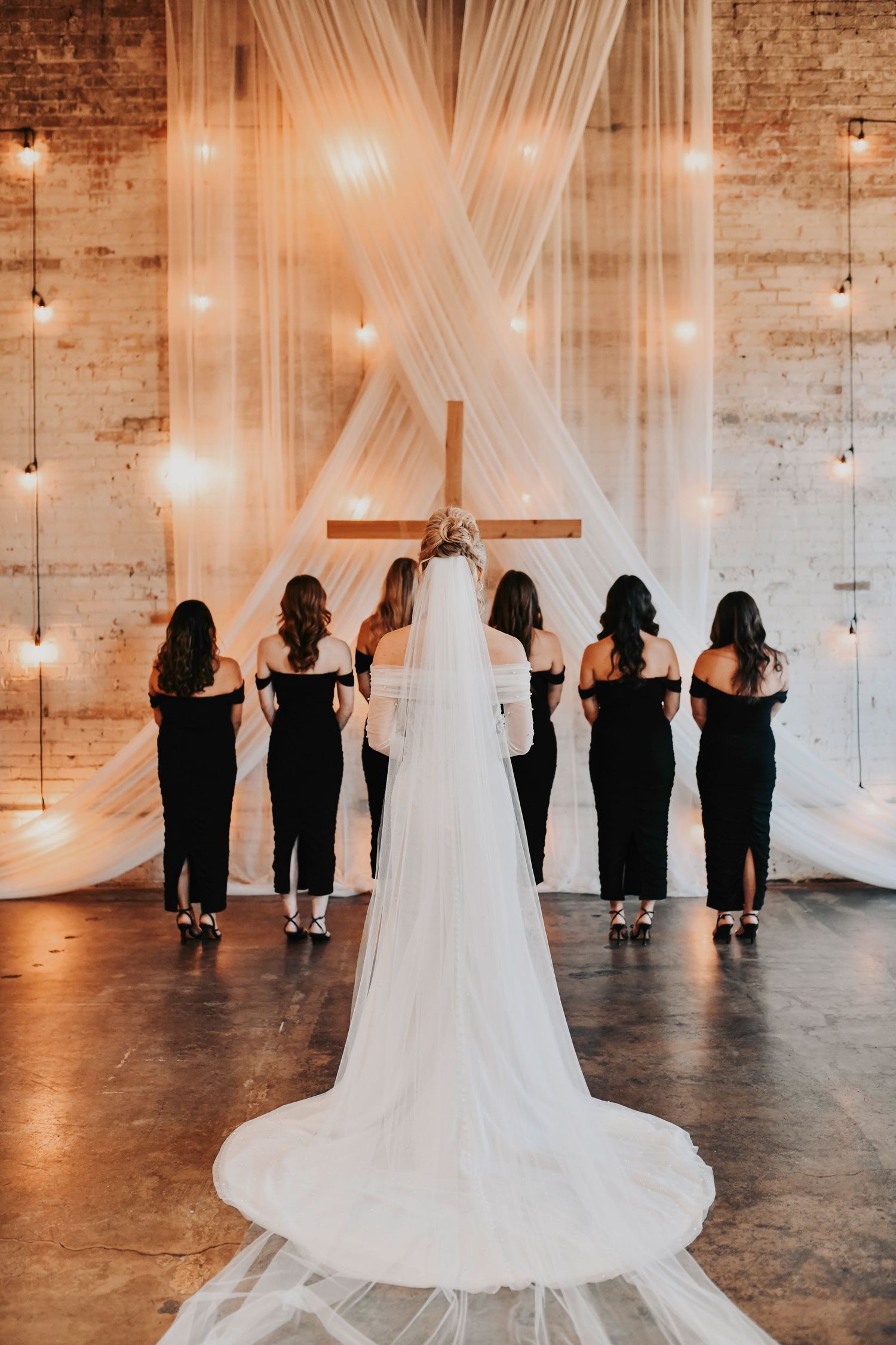 Bride sharing a joyful first look with her bridal party