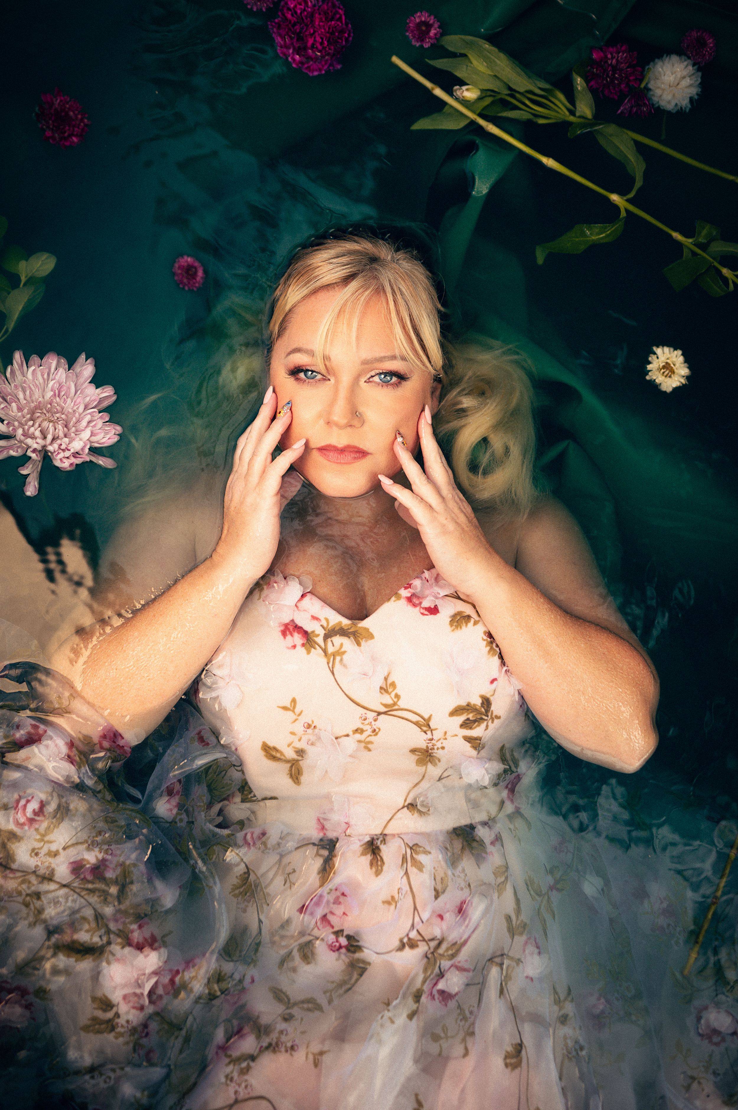 Outdoor Water Boudoir in Utah by Carl James. Unique and creative Boudoir Photography posing in the water surrounded by flowers.