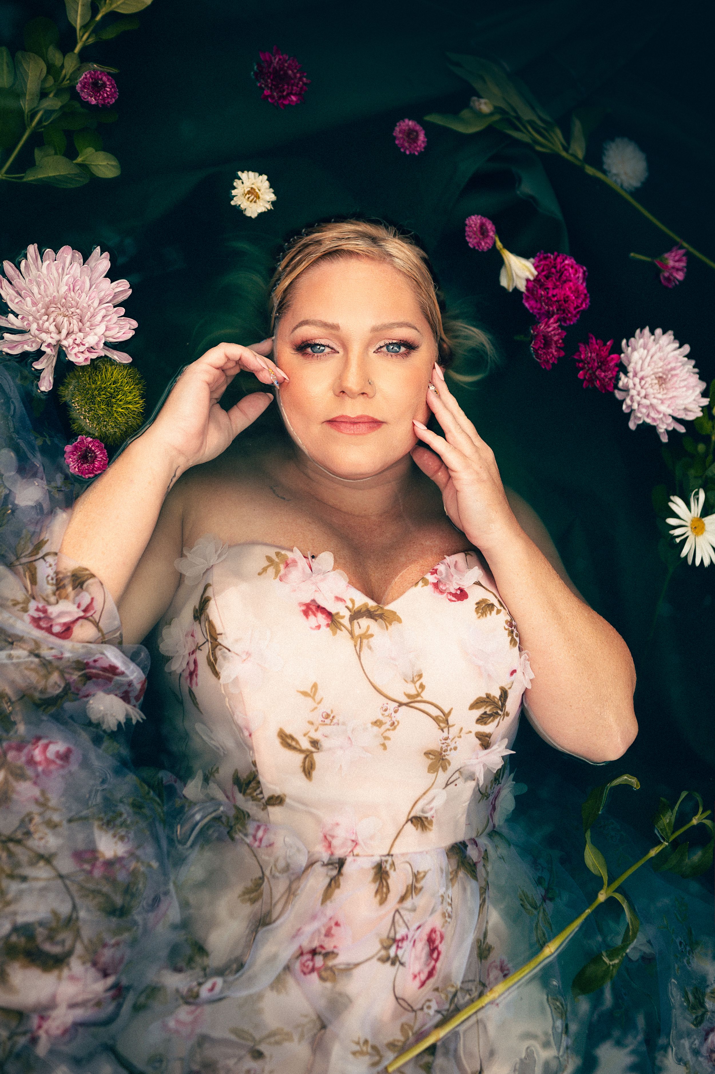Outdoor Water Boudoir in Utah by Carl James. Unique and creative Boudoir Photography posing in the water surrounded by flowers.
