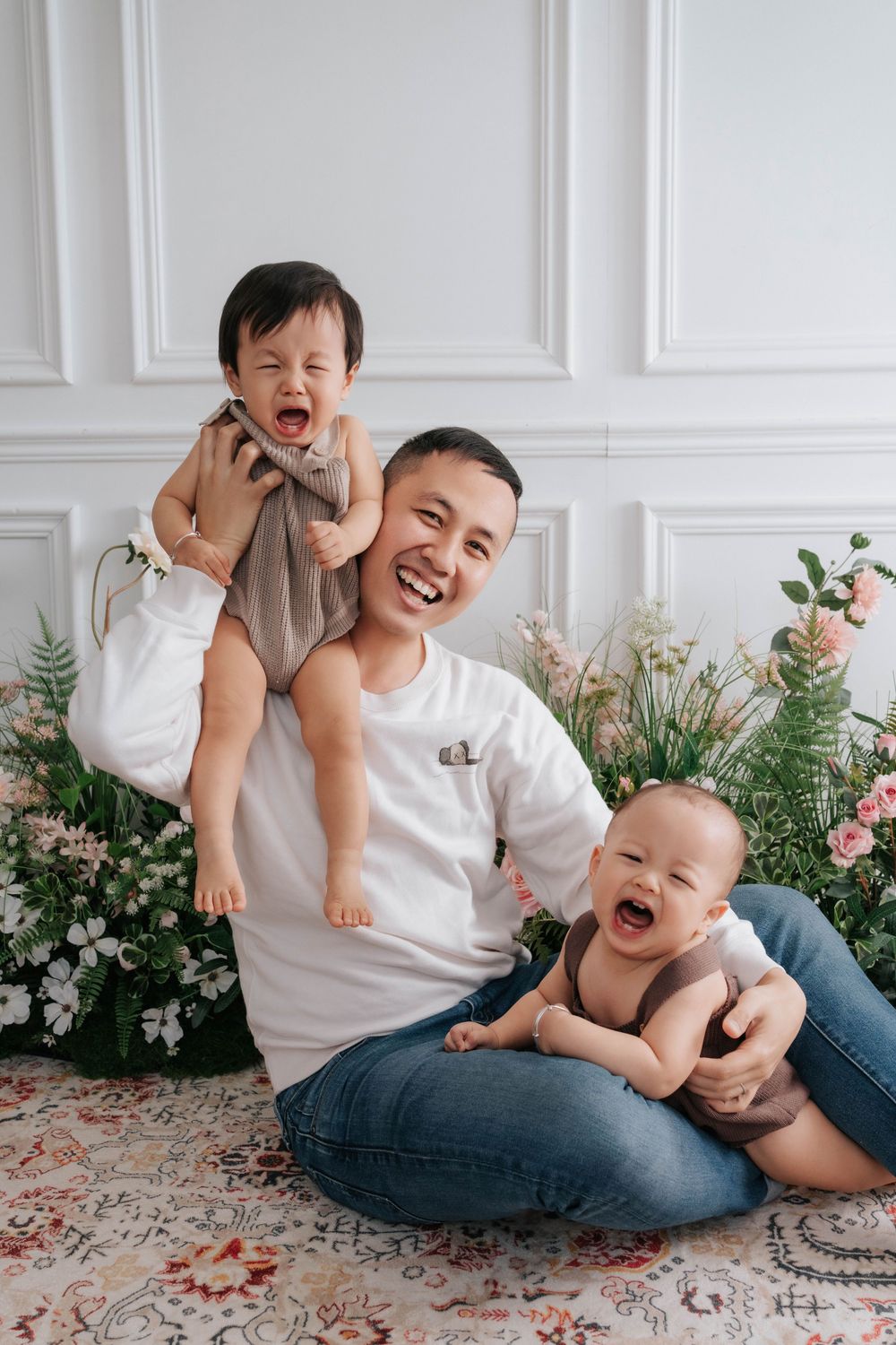 A playful family moment captured in a sequence of photos showing joyful laughter and bonding on a light colored floor.