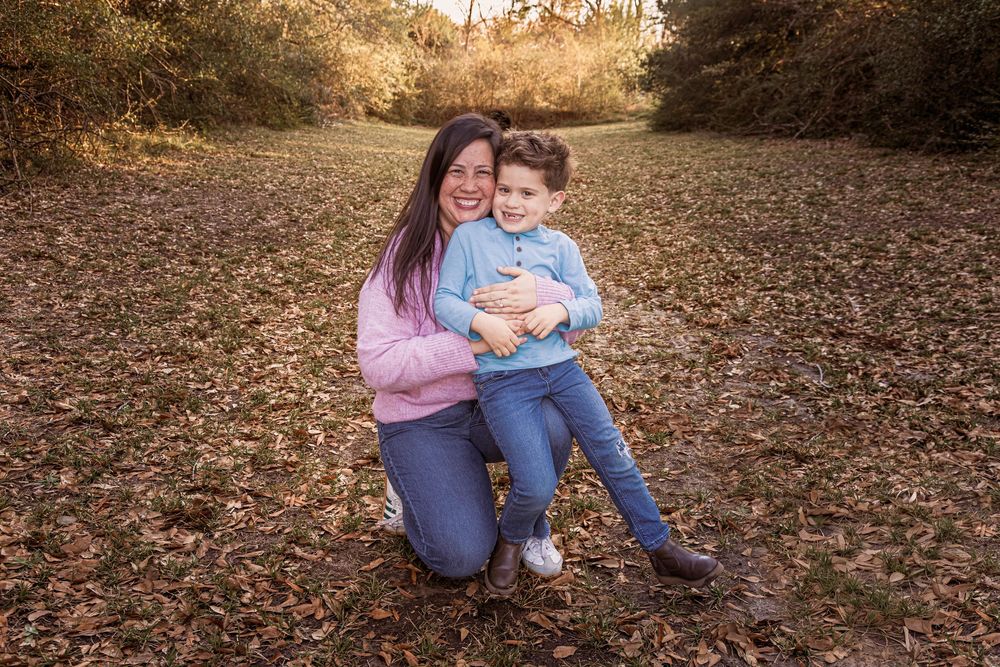 A series of candid autumn photos showing people sitting together on fallen leaves in a wooded outdoor setting at sunset.