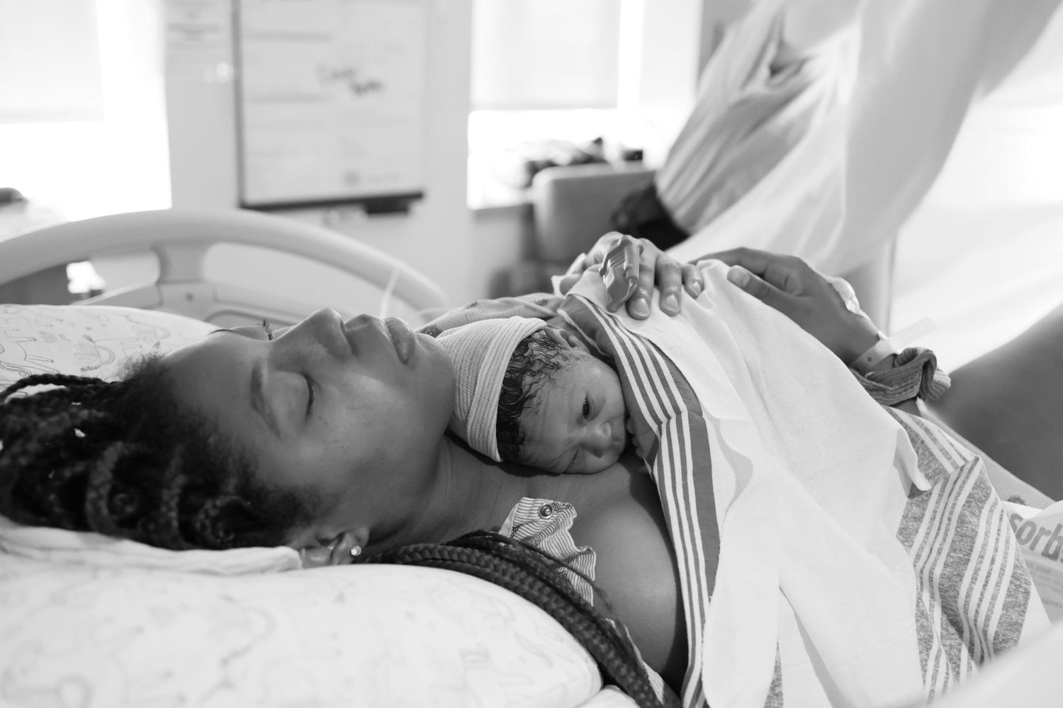 newborn on mother's chest