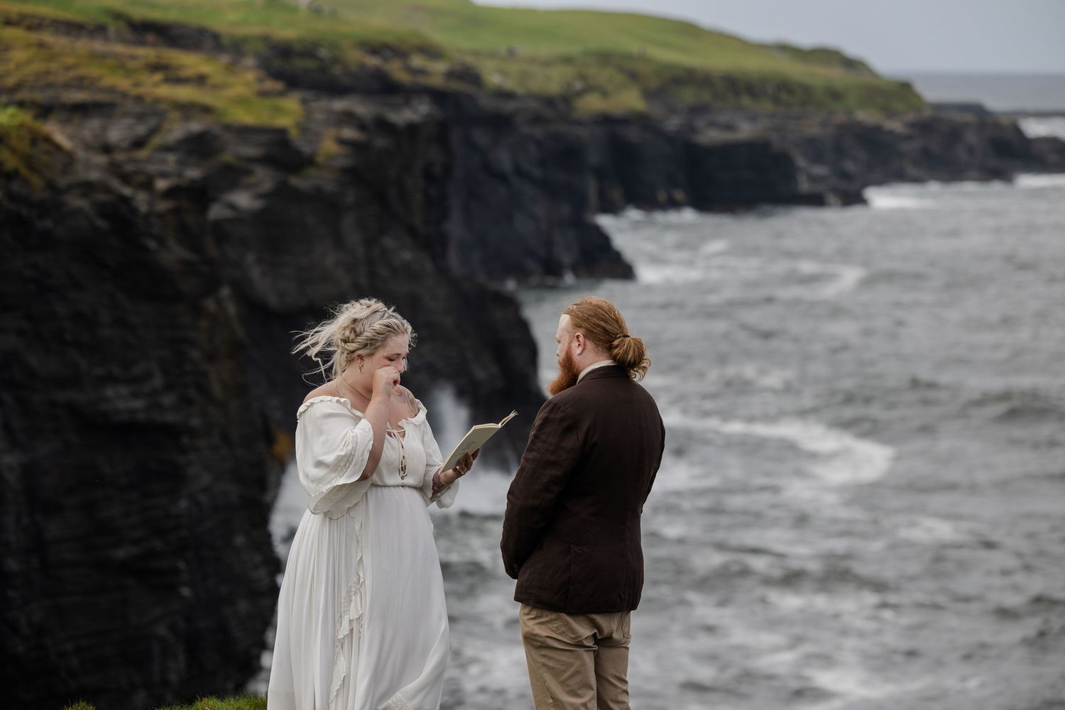 Intimate wedding ceremony at Doolin Cliff Walk with ocean and cliff views in County Clare