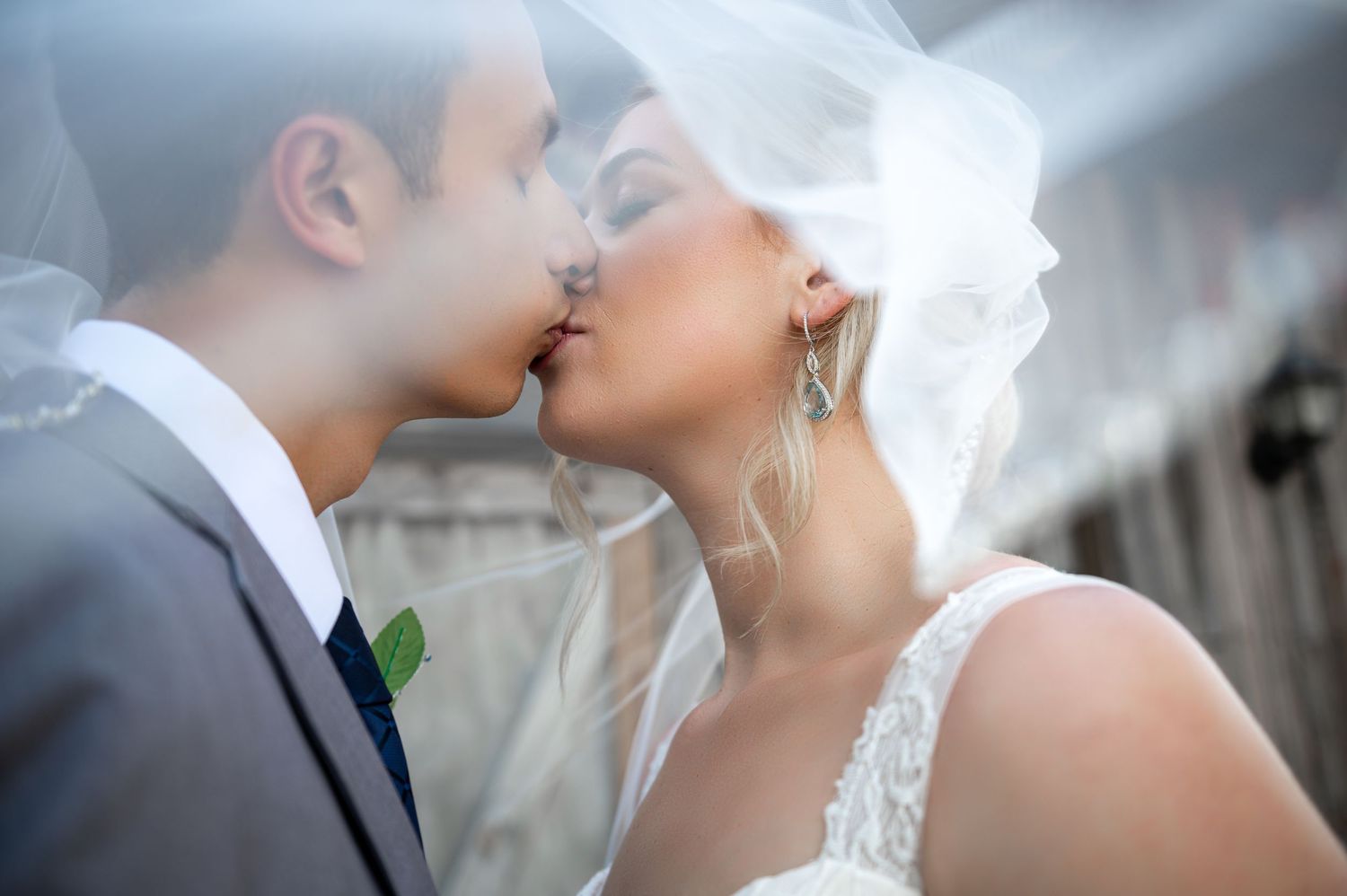Bride’s veil flowing in the breeze on Fort Lauderdale beach during golden hour.