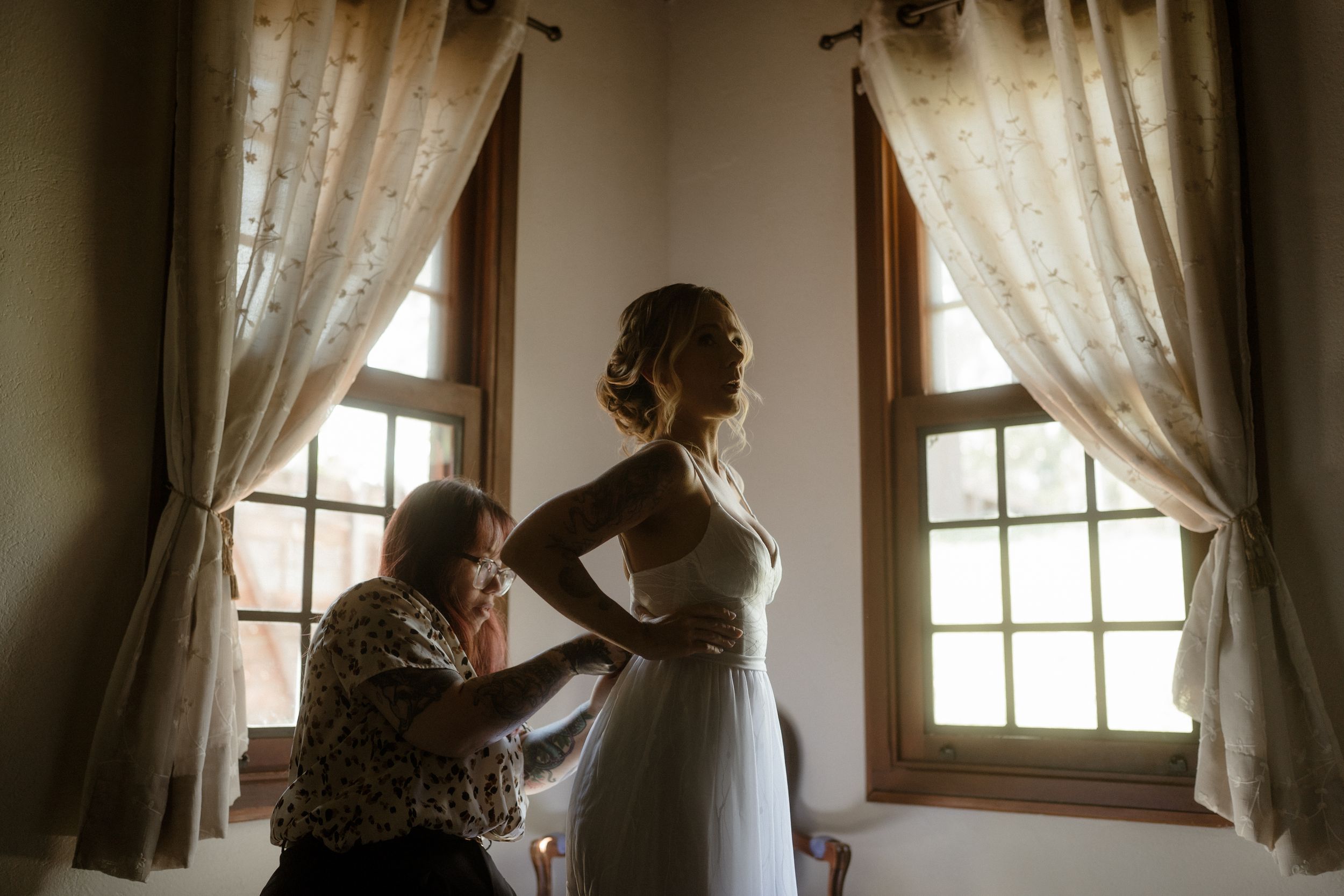 Light streams through sheer curtains creating a soft romantic atmosphere in a sunlit room.