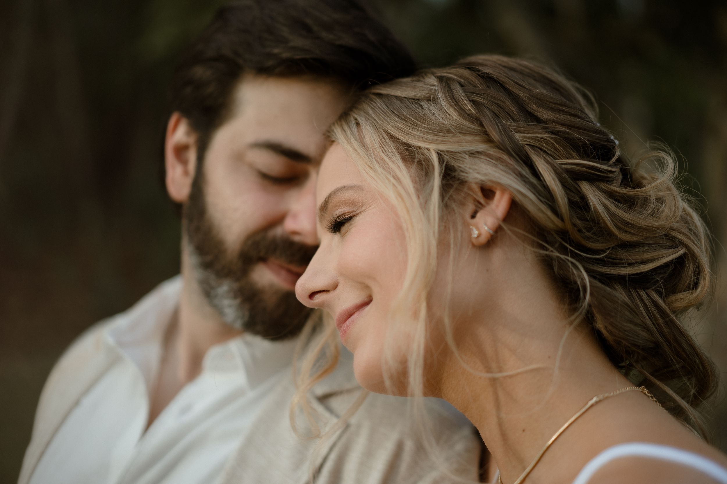 Intimate close-up portrait of couple sharing tender moment.