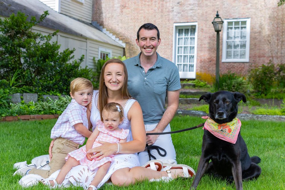 Family portrait session in Heritage Park in Sudbury, MA including a baby, toddler, parents and a dog.  Sudbury is located outside Boston, MA