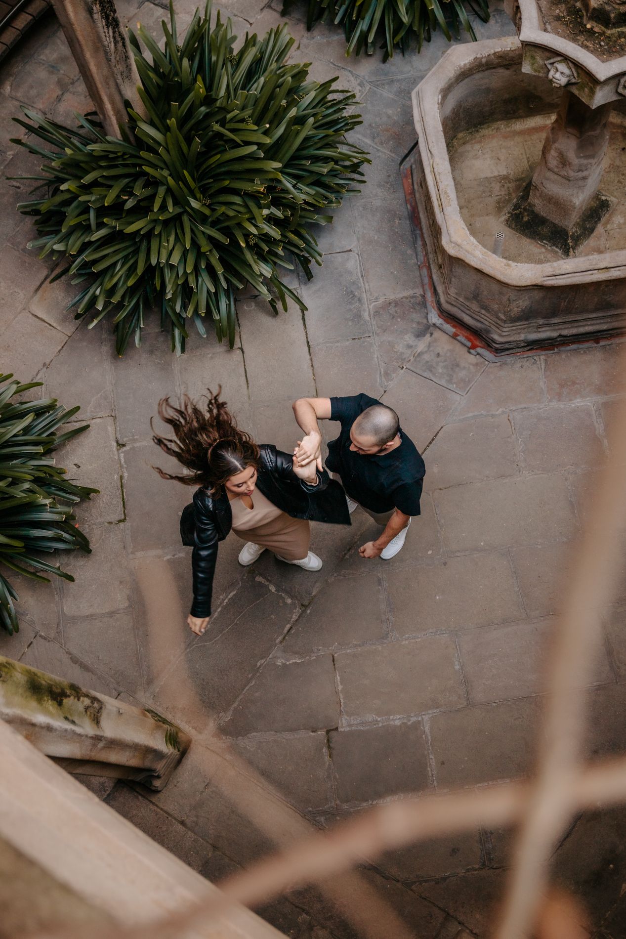 Playful laughter captured near an ancient wooden door in the old city.