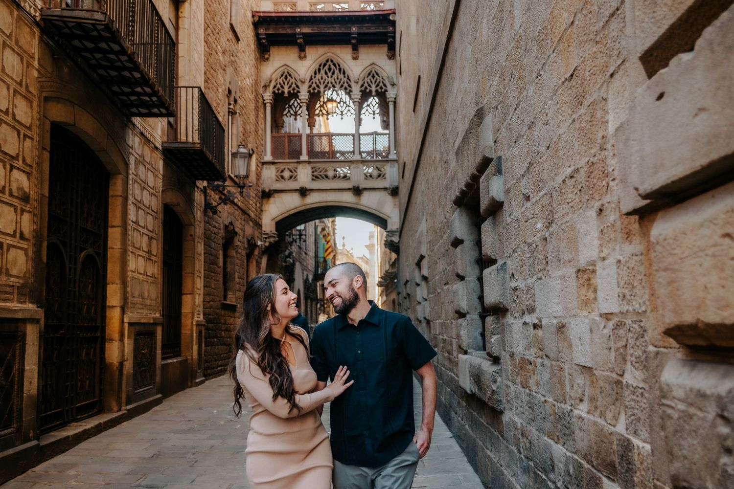 Romantic kiss shared in a quiet, empty alleyway.