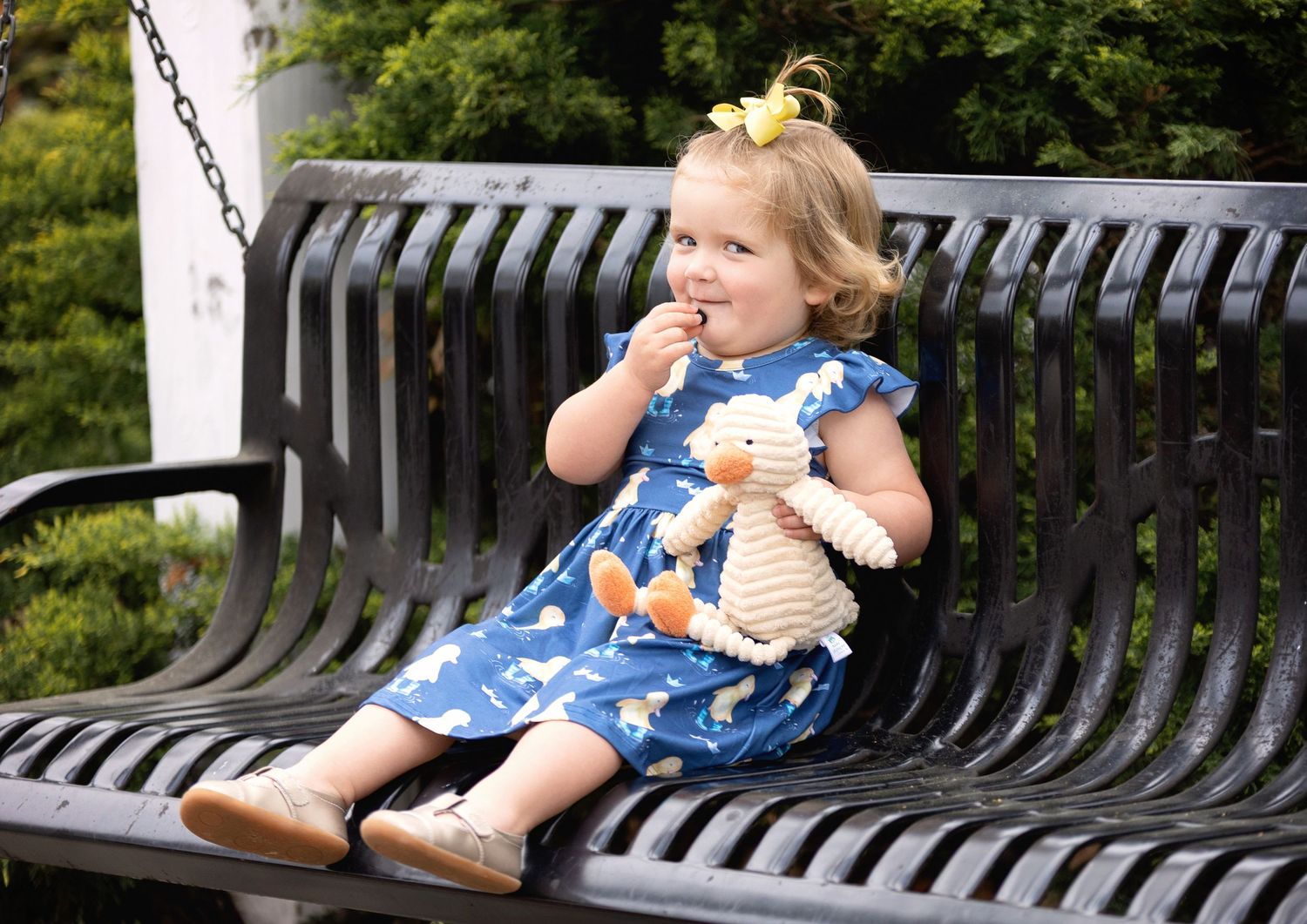 A two-year-old little girl with curls grinning. Greenville, SC newborn photographer. Easley, SC Newborn photographer