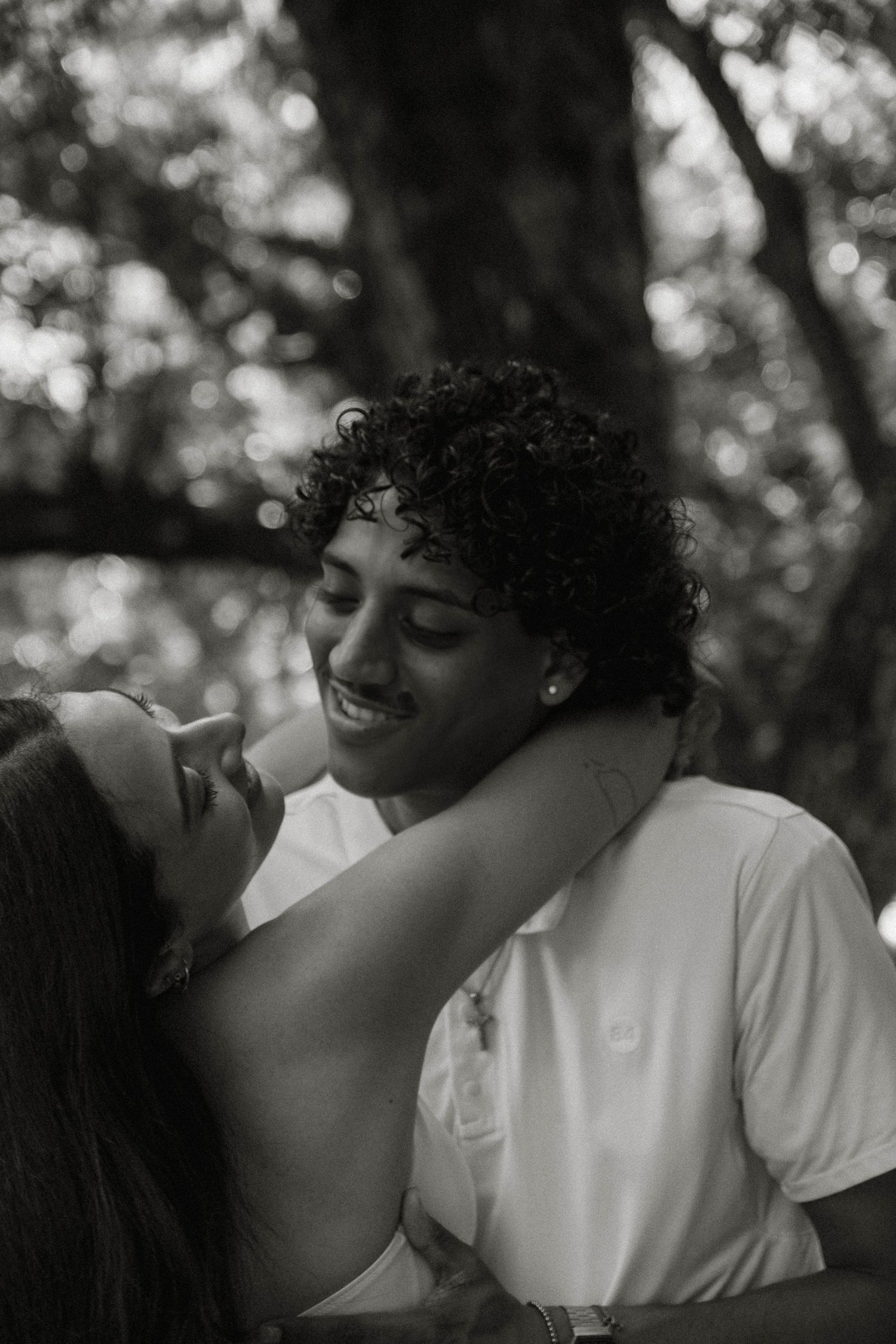 A romantic black and white photo sequence showing a tender moment between a couple.
