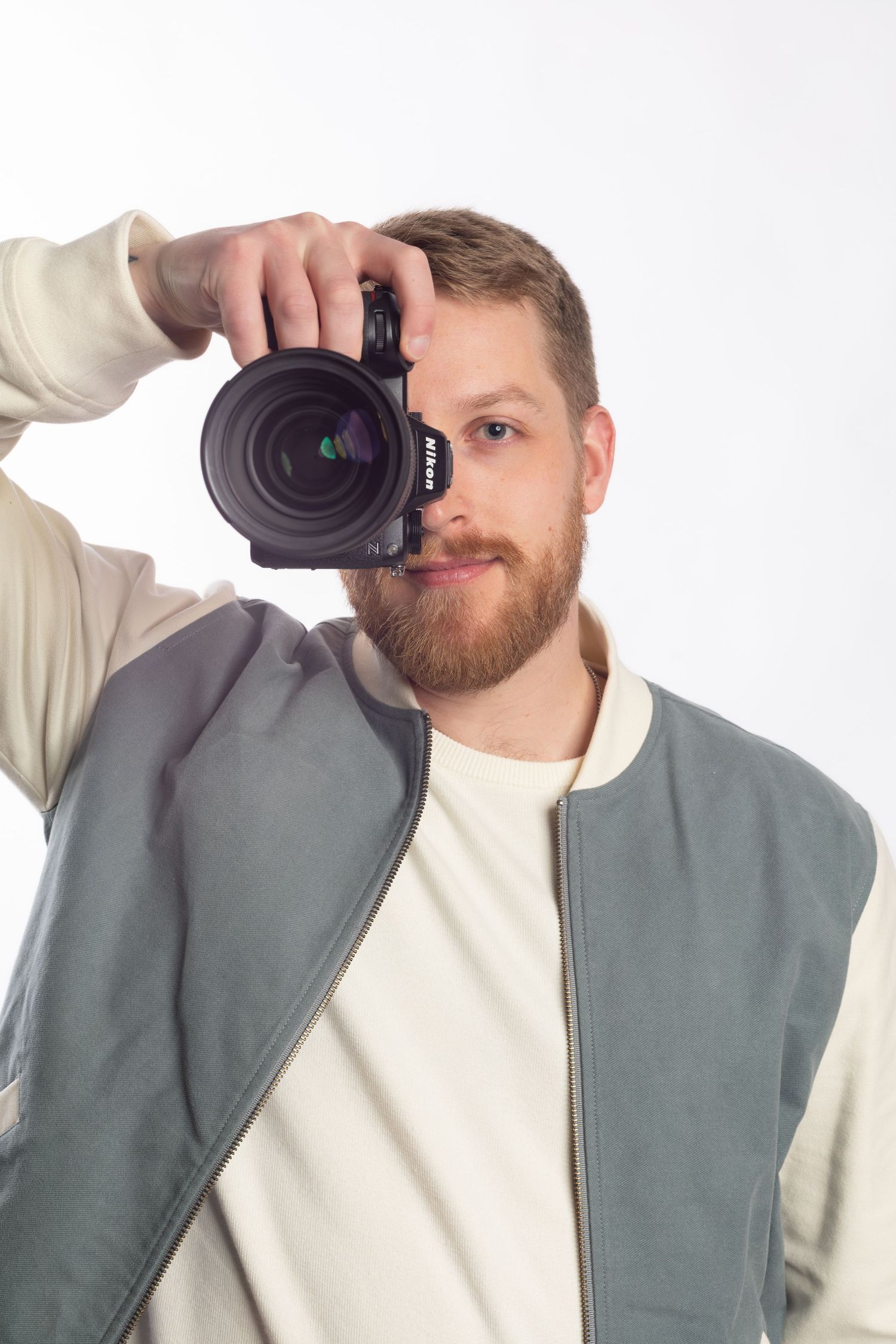 Portrait of WeberHansPhoto with a camera