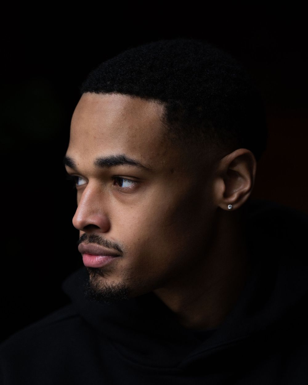 Expressive headshot of a young man, blending confidence and emotion. Perfect for portfolios, creative projects, and personal branding.