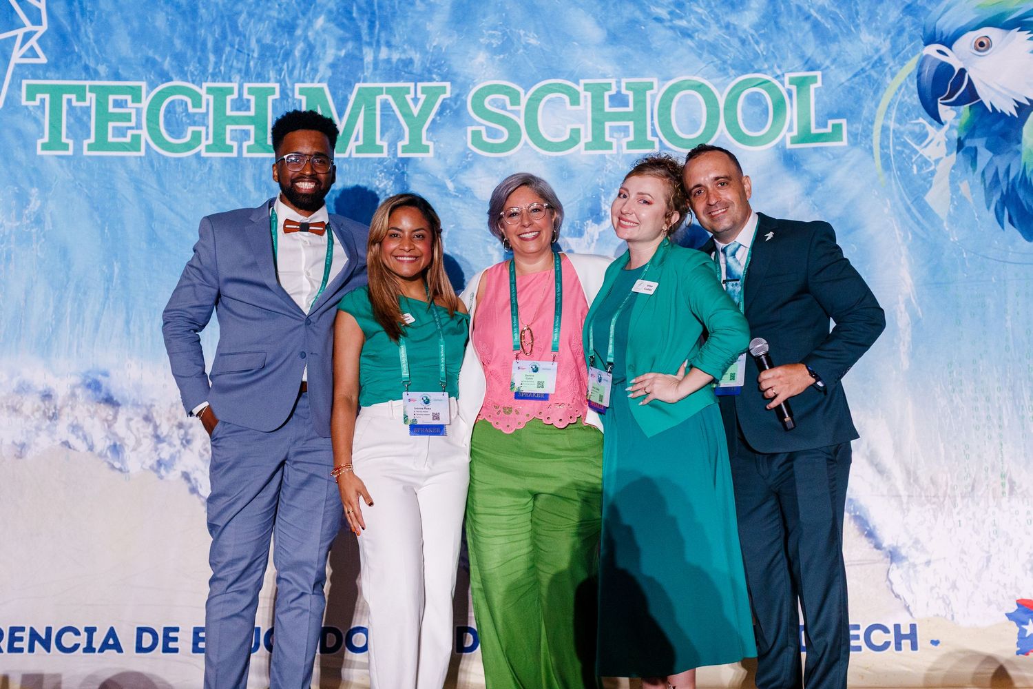 Staff photo on stage at the Spring Educators Conference held at the Wyndham Grand Rio Mar in Rio Grande, Puerto Rico.