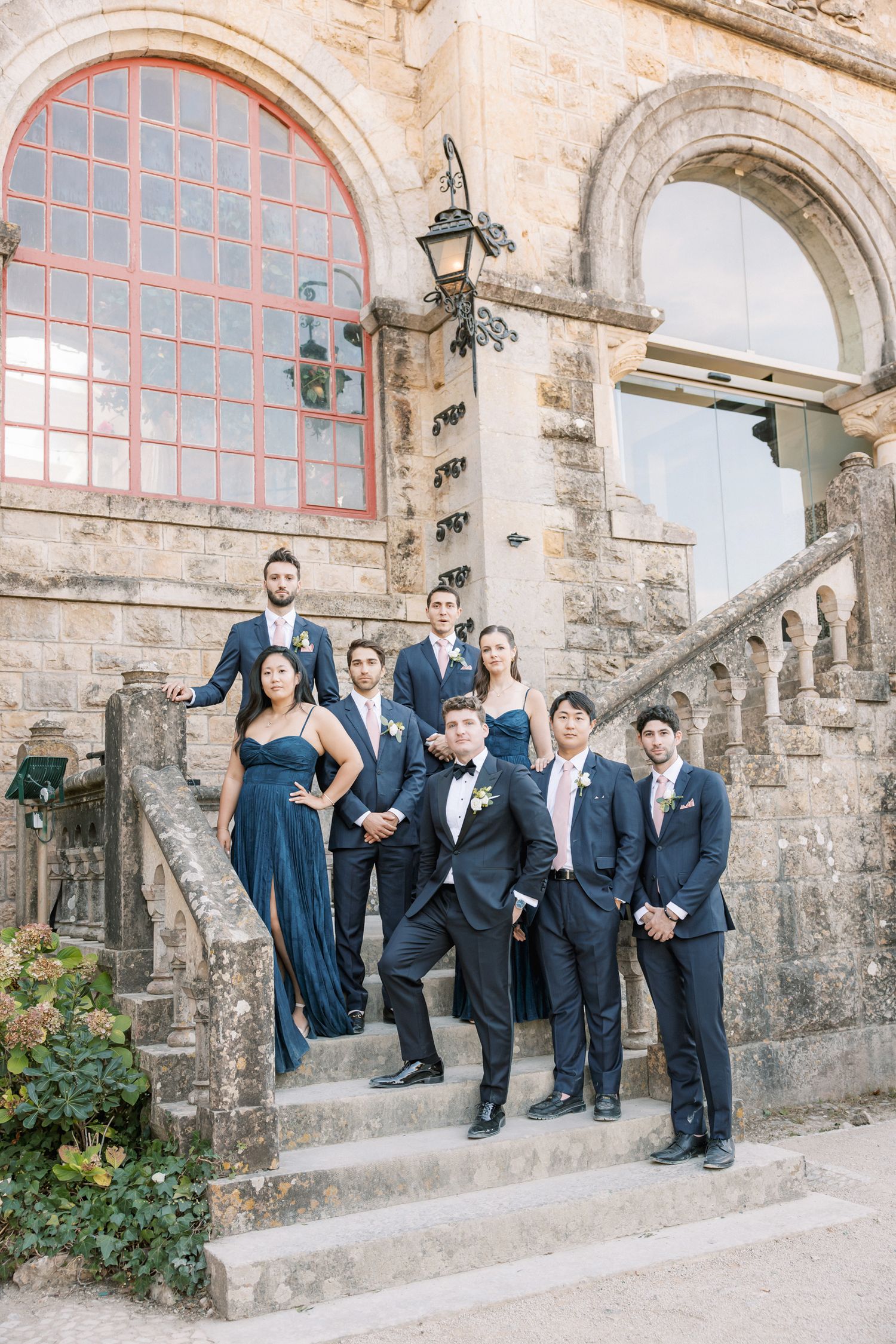 Relaxed groomsmen portraits by the sea at Forte da Cruz in Cascais