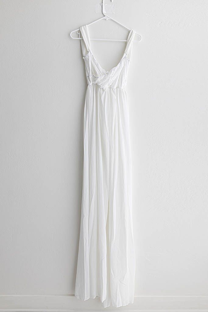 White sleeveless empire waist maxi dress with ruched bodice for maternity photography in Murrieta.